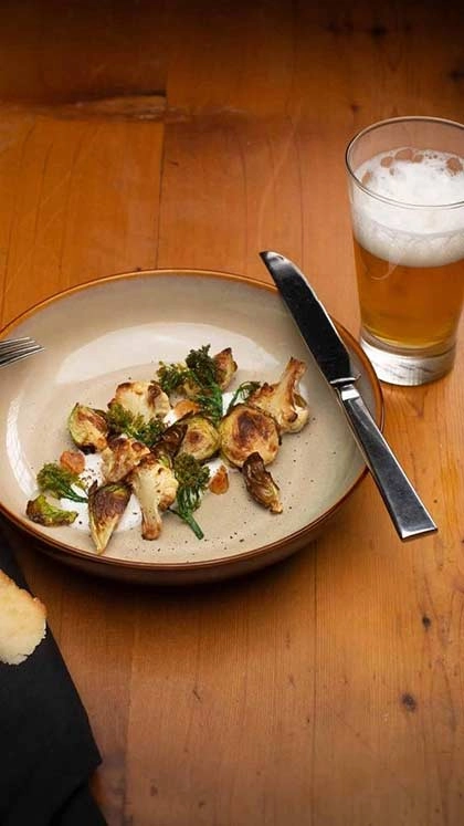 Beer with Roasted Brussels and Cauliflower at the CIA's Savor restaurant in the Pearl District of San Antonio, Texas.